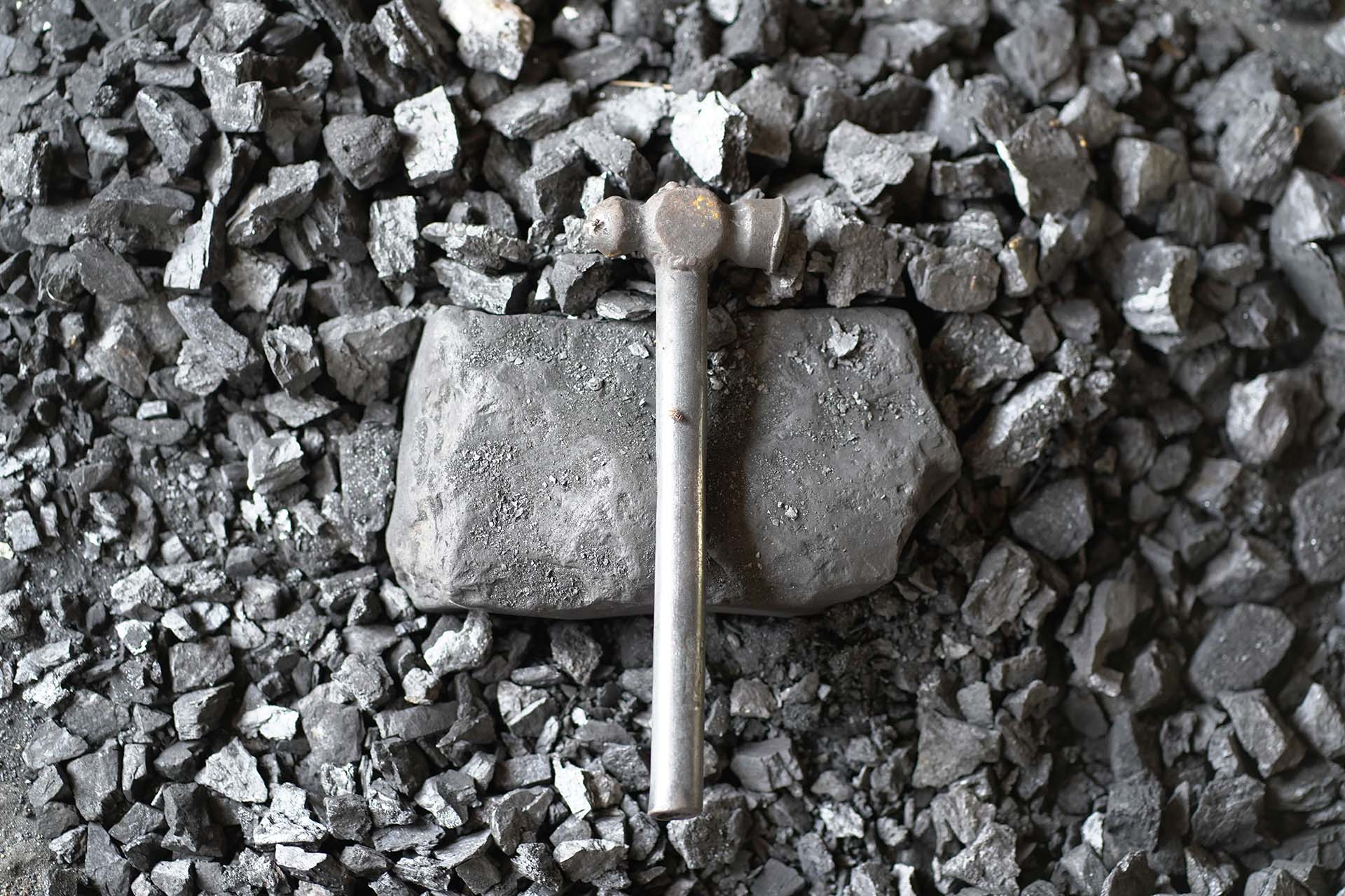 Iron hammer cracking some small rocks
